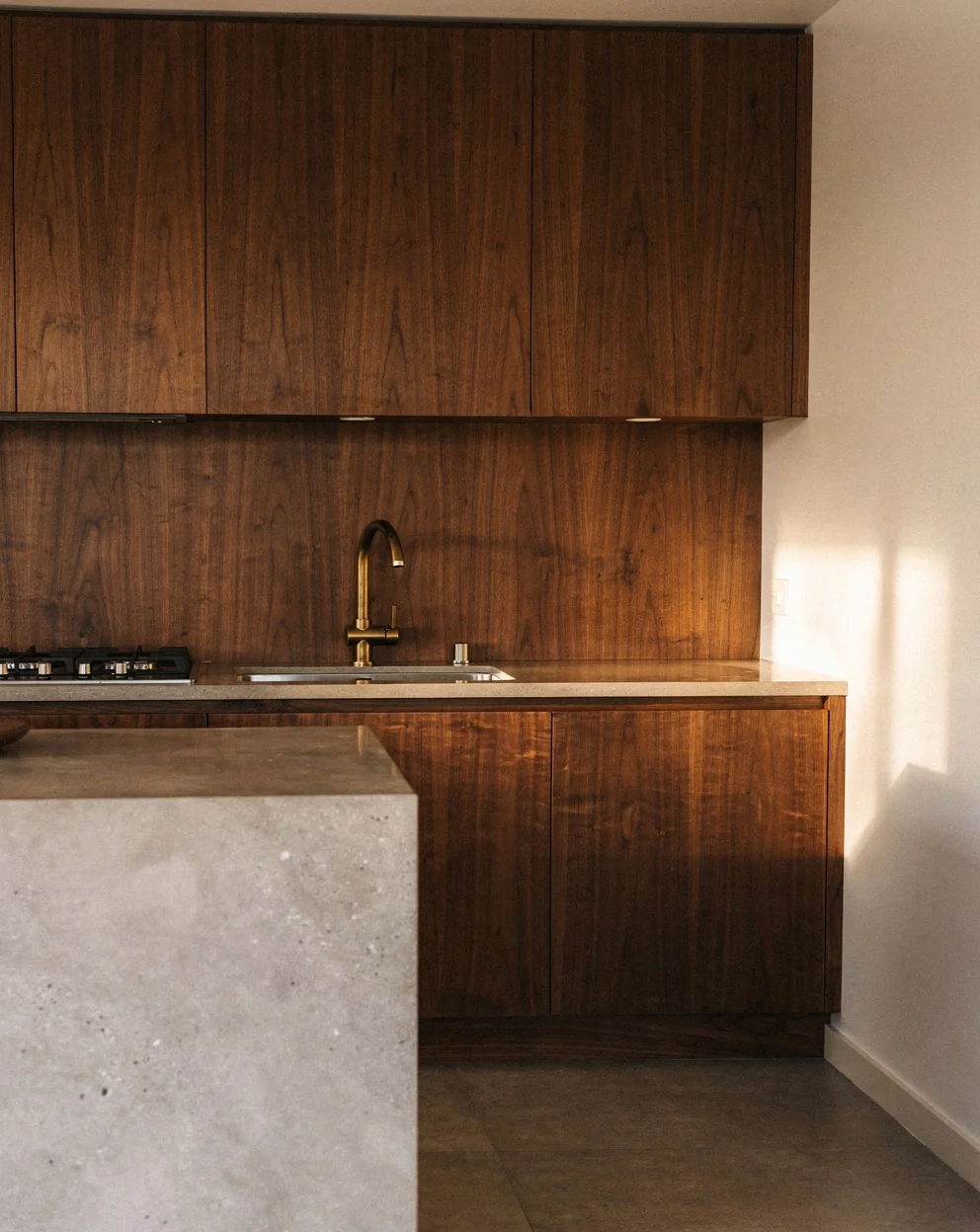 Finished Grainline kitchen with timber-grain cabinetry and stone island